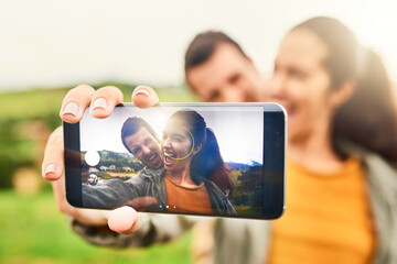 Sticker - True love can be seen in pictures. Cropped shot of a loving couple taking a selfie outdoors.