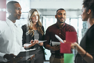 Aufkleber - the content creators. shot of a group of young businesspeople brainstorming in a modern office.