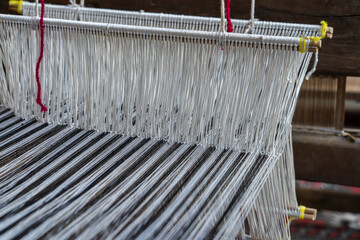 Wall Mural - Old hand-weaving vintage wooden loom being used to make fabric