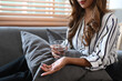 © Prathankarnpap - Cropped image of woman holding a glass of water and pills. Pharmacy and healthcare concept.