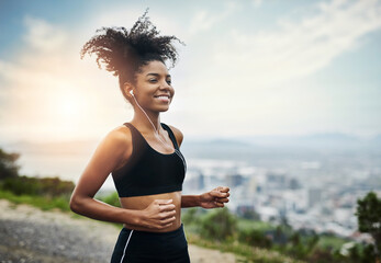 Sticker - Run with all your heart. Shot of a sporty young woman running outdoors.