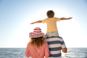 Wall Mural - Happy family having fun on summer vacation