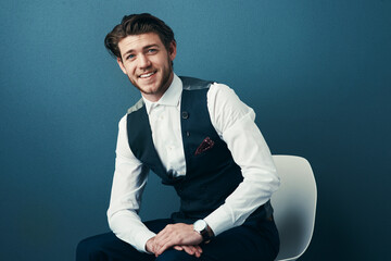 Poster - Im just getting started. Studio shot of a handsome young businessman posing against a blue background.