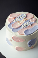 Canvas Print - Bento cake with blue and pink cream cheese frosting and Happy birthday text on top. Birthday cake on a gray background. Asian small cake trend.