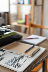 Clapper board and vintage typewriter on desk table. Screenwriter creative concept