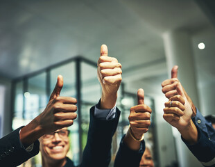 Leinwandbilder - We like it a lot. Closeup shot of a group of unrecognizable businesspeople showing thumbs up in an office.
