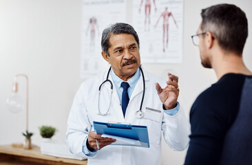 Aufkleber - We need to get you started on the treatment immediately. Shot of a confident mature male doctor consulting a patient inside a hospital during the day.