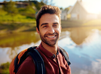 Poster - I love being out here. Cropped portrait of a handsome young man spending the day at a lake.
