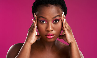 Poster - Once Im focused ,I go for what I want. Studio shot of a beautiful young woman posing against a pink background.