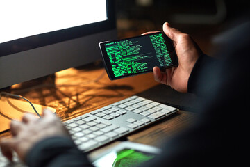 Poster - Secure your system before its too late. Cropped shot of an unidentifiable hacker cracking a computer code in the dark.