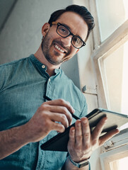 Aufkleber - It takes determination most of the time. Cropped portrait of a handsome young businessman smiling while using a digital tablet in a modern office.