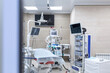 © pantovich - Patient monitor with vital signs in operating room with medical equipment. Preparing for the operation
