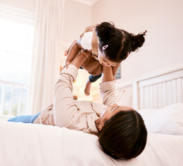 Sticker - Its playtime with mommy. Shot of a little girl playing with her mother at home.