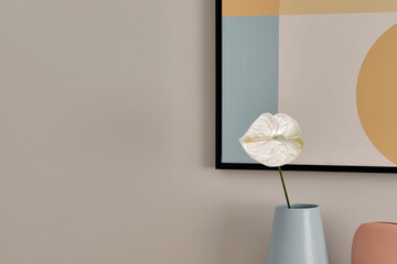 Wall Mural - Single white Anthurium flower in blue vase in home interior. Modern interior decoration concept.