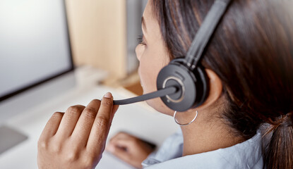 Poster - On call and on the case. Shot of a woman using a headset and laptop in a modern office.