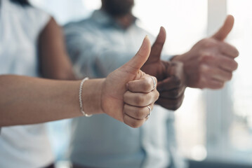 Aufkleber - Time to go all the way with our business. Cropped shot of an unrecognizable group of businesspeople standing together and making a thumbs-up gesture in the office.