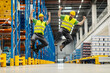 © Dusan Petkovic - Two warehouse workers jumping and celebrating success.