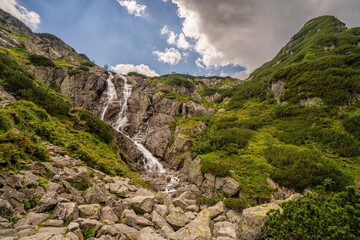 Wall Mural - Zakopane, Poland : Siklawa waterfall or Wielka Siklawa in the High Tatras, on the Roztoka stream. It falls from the pond wall separating valleys of Pieciu Stawow Polskie and Roztoki.