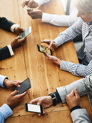 Aufkleber - Staying within reach of success. Shot of a group of unrecognisable businesspeople using their cellphones in synchronicity.