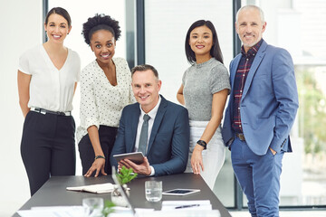 Aufkleber - All in a days work. Portrait of a group of businesspeople working together in a modern office.