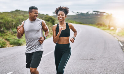 Fototapete - The healthier you are, the happier you feel. Shot of a sporty young couple exercising together outdoors.