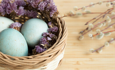  Easter basket with eggs willow branch Easter composition. Close-up. Selective focus. Banner