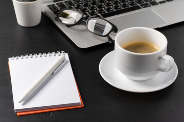 Sticker - Notepad is on top of office desk table with laptop and supplies