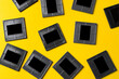 © fotofabrika - Photography empty slide frames on yellow background