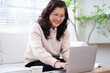 © Timeimage - Image of senior Asian businesswoman working at home