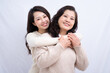 © Timeimage - Portrait of Asian mother and daughter on white background
