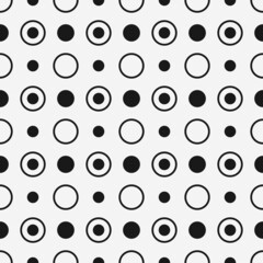 Poster - Polka dots in black on a seamless canvas. Vector.