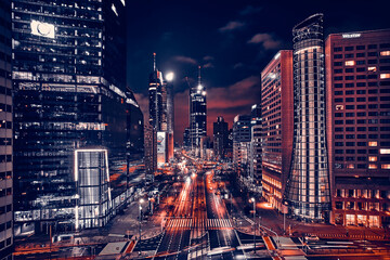 Wall Mural - Beautiful panoramic aerial drone skyline view of the center of night Warsaw with skyscrapers in the background on avenues of John Paul II - the lights of the big city by night, Poland, EU
