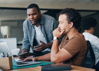 Aufkleber - Im just going to give you some feedback on that. Shot of two young businessmen working together in an office.