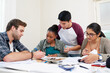 © Marius V/peopleimages.com - Hes a great tutor. Cropped shot of a group of university students in a study group.