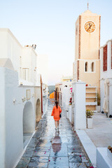 Wall Mural - Young woman in Oia village