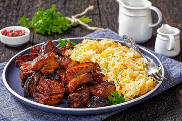 Canvas Print - braised sauerkraut with pork and prunes on plate