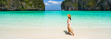 Young Woman Traveler Relaxing And Enjoying At Beautiful Tropical White Sand Beach At Maya Bay In Krabi, Thailand, Summer Vacation And Travel Concept