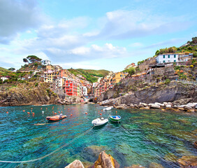 Wall Mural - amazing cityscape with boats and colored houses in riomaggiore, cinque terre, italy. amazing places.