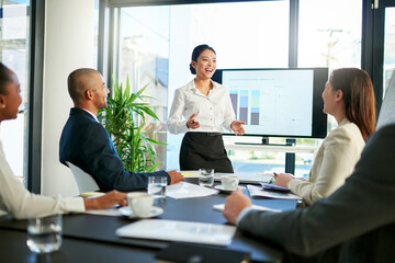 Poster - Business has been going very well so far. Cropped shot of a group of business colleagues meeting in the boardroom.