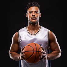 Who Goes First. Studio Shot Of A Basketball Player Against A Black Background.