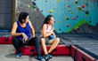 © Ann Rodchua - Asian mother teaching her caucasian daughter to climbing rock for indoor sport. Activity, Family and Education Concept.
