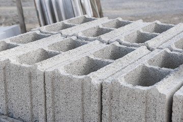 Pallet of Concrete Cinder Blocks, Grey Uniformed brick Shapes building material. New for use  on construction site in Israel.