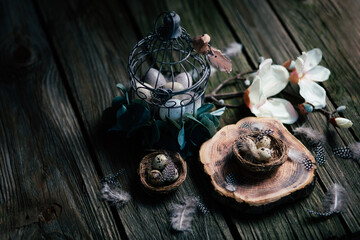 Wall Mural - Beautidul Easter decorations of quail eggs and magnolie on wooden background