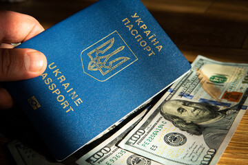 Wall Mural - Ukrainian passport on a background of dollars