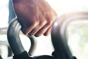 Poster - Take a lift or go home. Cropped shot of an unrecognizable sportsman lifting kettle bells in a gym.