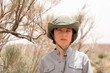 © Sergey Kohl - Portrait of a teenager in a hat on the background of nature. Sunny day.