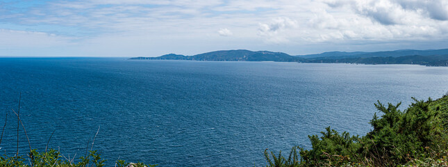 Landscape of the ocean and the sea from the grass