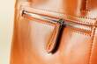 Leinwandbild Motiv zipper on the leather bag close-up