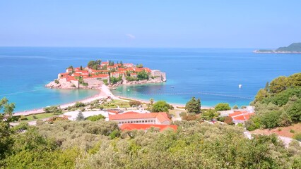 Fototapete - Gorgeous view of the small islet Sveti Stefan. Filmed in UHD 4k video.