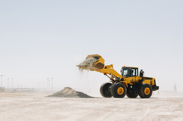 Wall Mural - Dozer, excavator, and road rollers working on the mud site